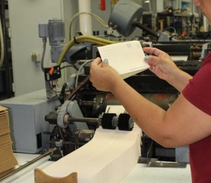 Lady Inspecting Tan Envelope